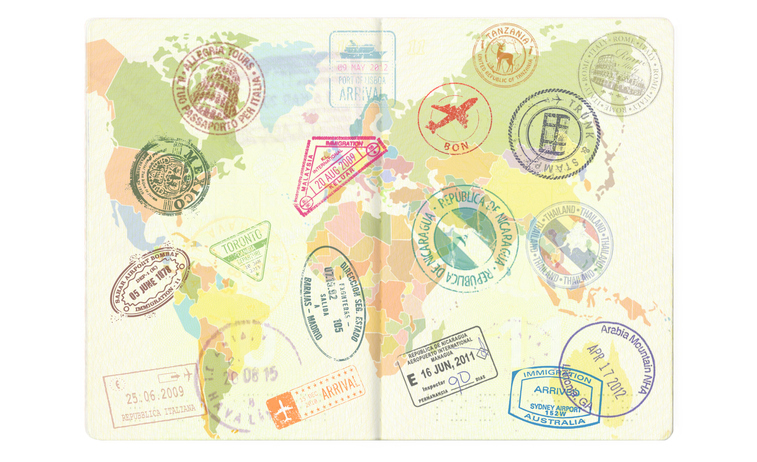 Different visa stamps on a passport.