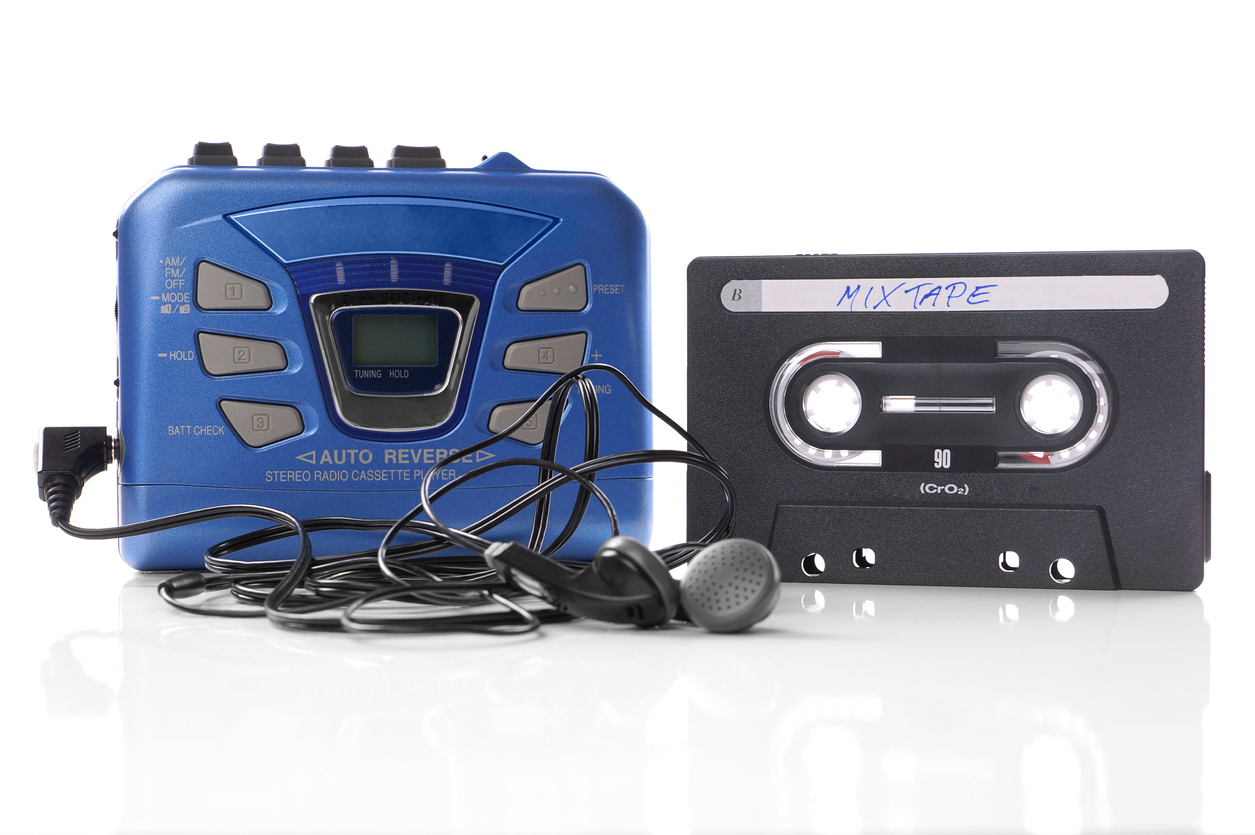 Walkman with earphones and cassette tape