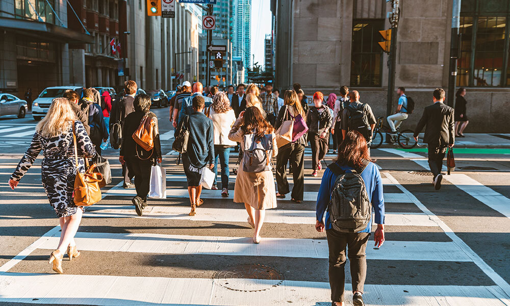 Group of people crossing street of Canada